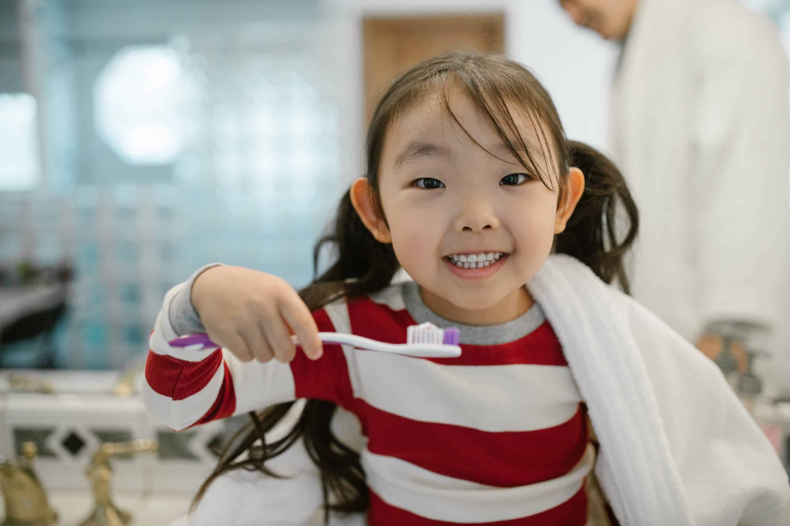 Child in Marietta Georgia brushing her teeth
